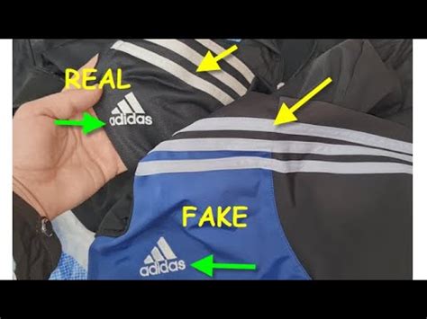 fake adidas tracksuit vs real|adidas tracksuit jacket.